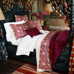A John Robshaw hand quilted bed with a cotton voile canopy featuring the Aisha Berry Quilt. - 30395676786734