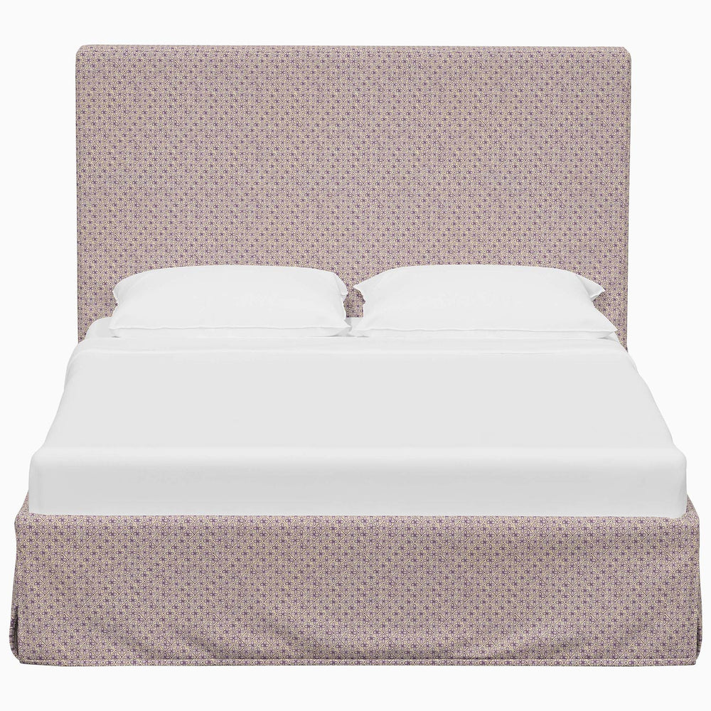 A Shona Bed with a white sheet and a pink John Robshaw print cover.