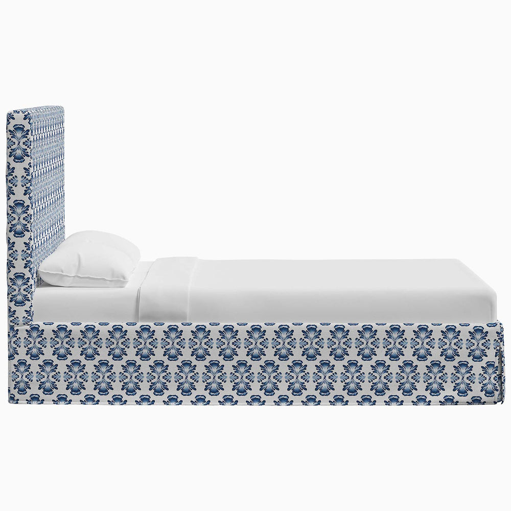 A Shona Bed with a Shona-inspired patterned cover in blue and white prints by John Robshaw.