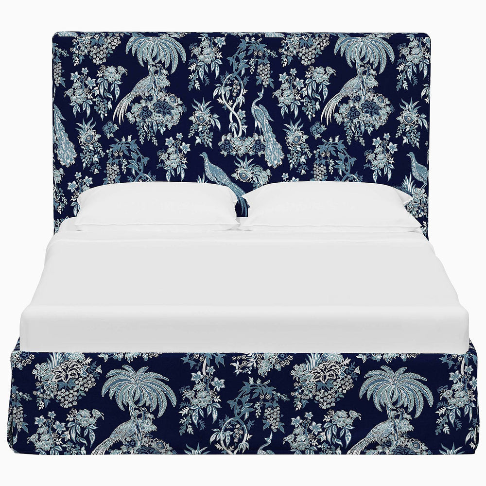 A Shona Bed by John Robshaw with a blue and white floral print.