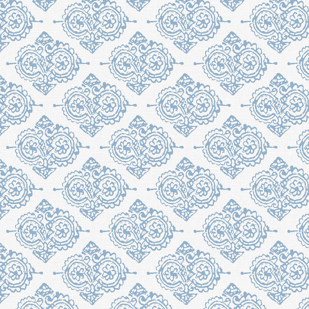 A John Robshaw Shona Bed, with a blue and white damask pattern on a white background, perfect for prints and fabrics.