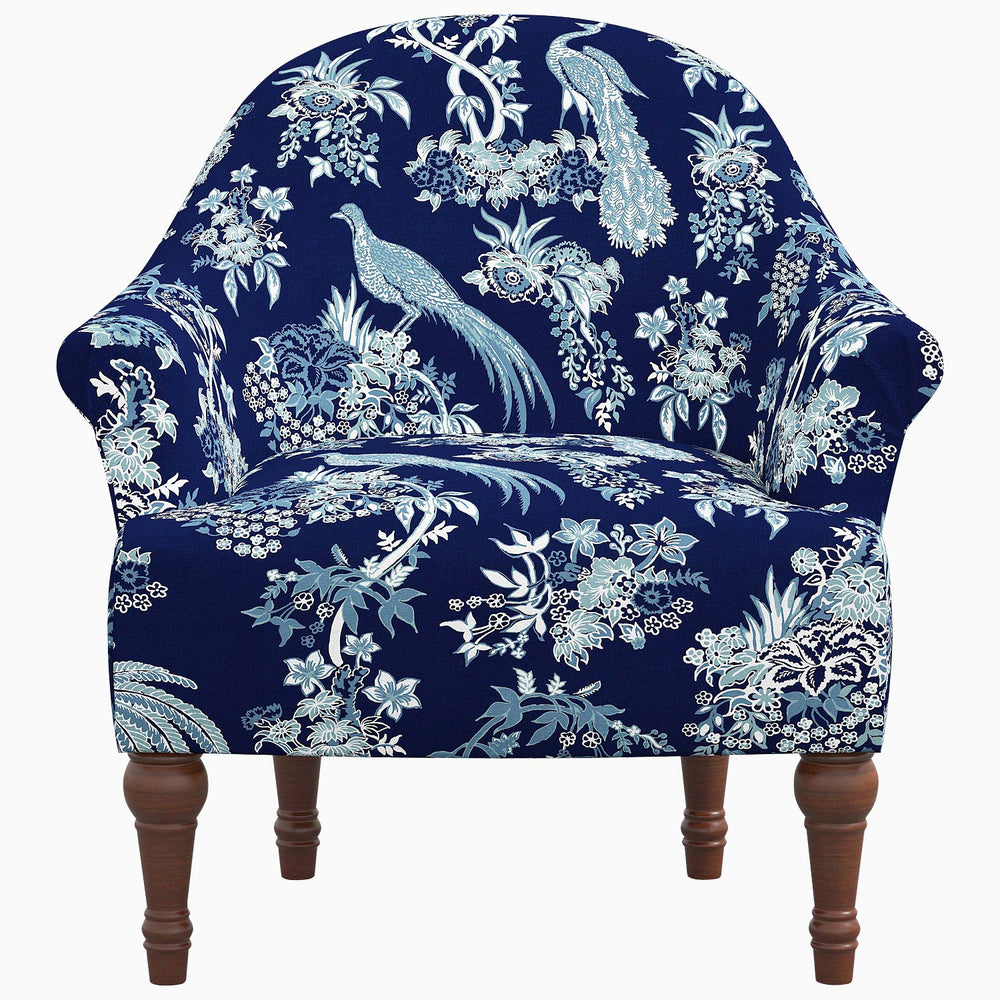 A blue and white Preeti Accent Chair featuring an adventurous peacock print, made-to-order with exquisite attention to detail by John Robshaw.