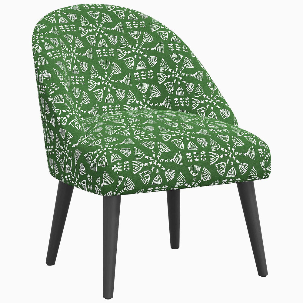 A Chetna Accent Chair inspired by John Robshaw's prints, with wooden legs.