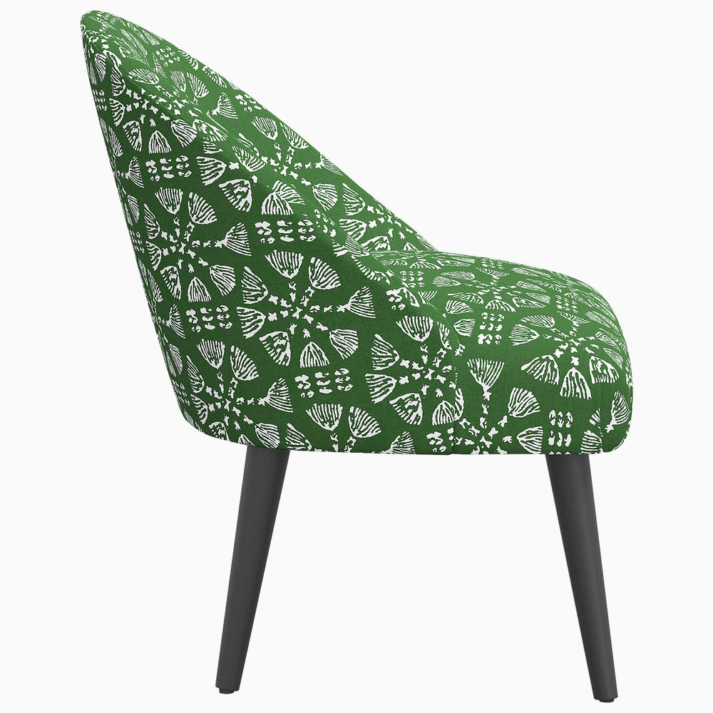 A mid-century Chetna Accent Chair by John Robshaw with prints inspired by John.