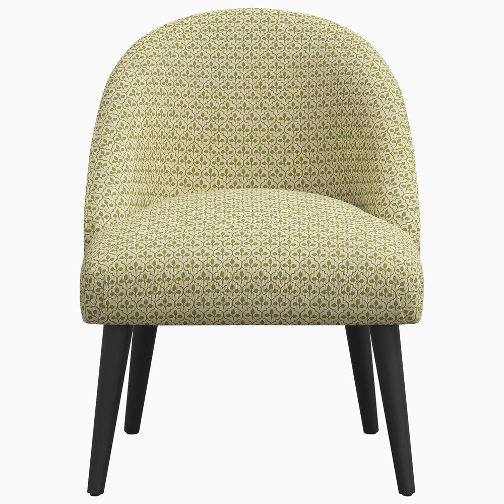 A Chetna Accent Chair by John Robshaw, featuring a green pattern and black legs, with prints inspired by John.