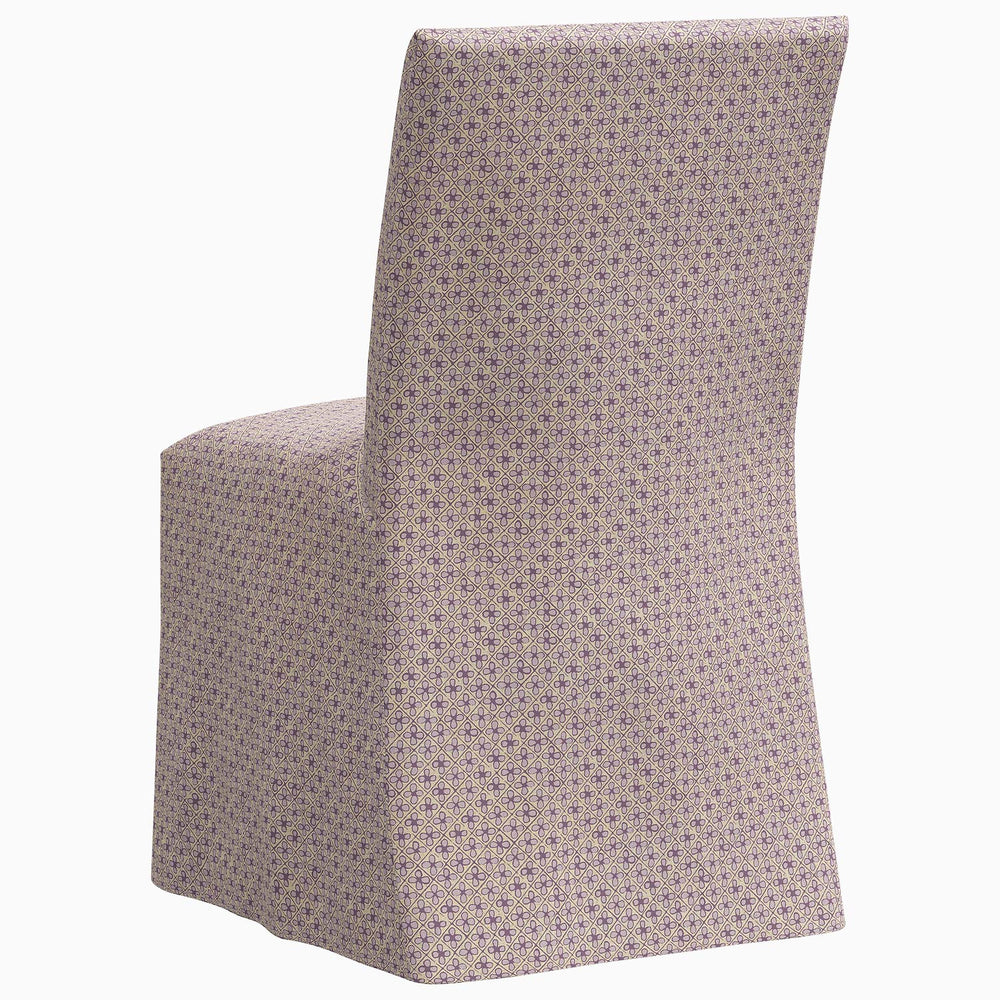 The John Robshaw Sadia Slipcover Chair with a purple polka dot pattern.