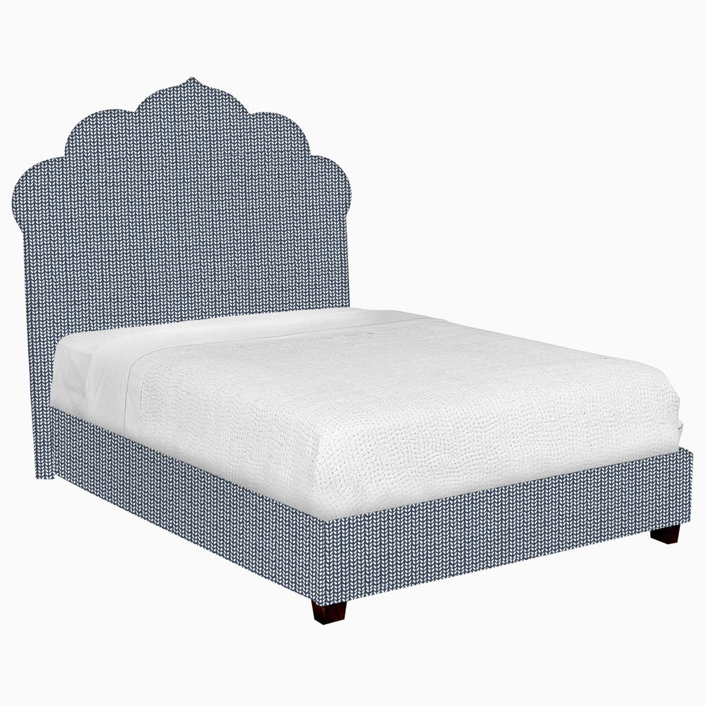 A John Robshaw Custom Bihar Bed with a blue fabric headboard and footboard.