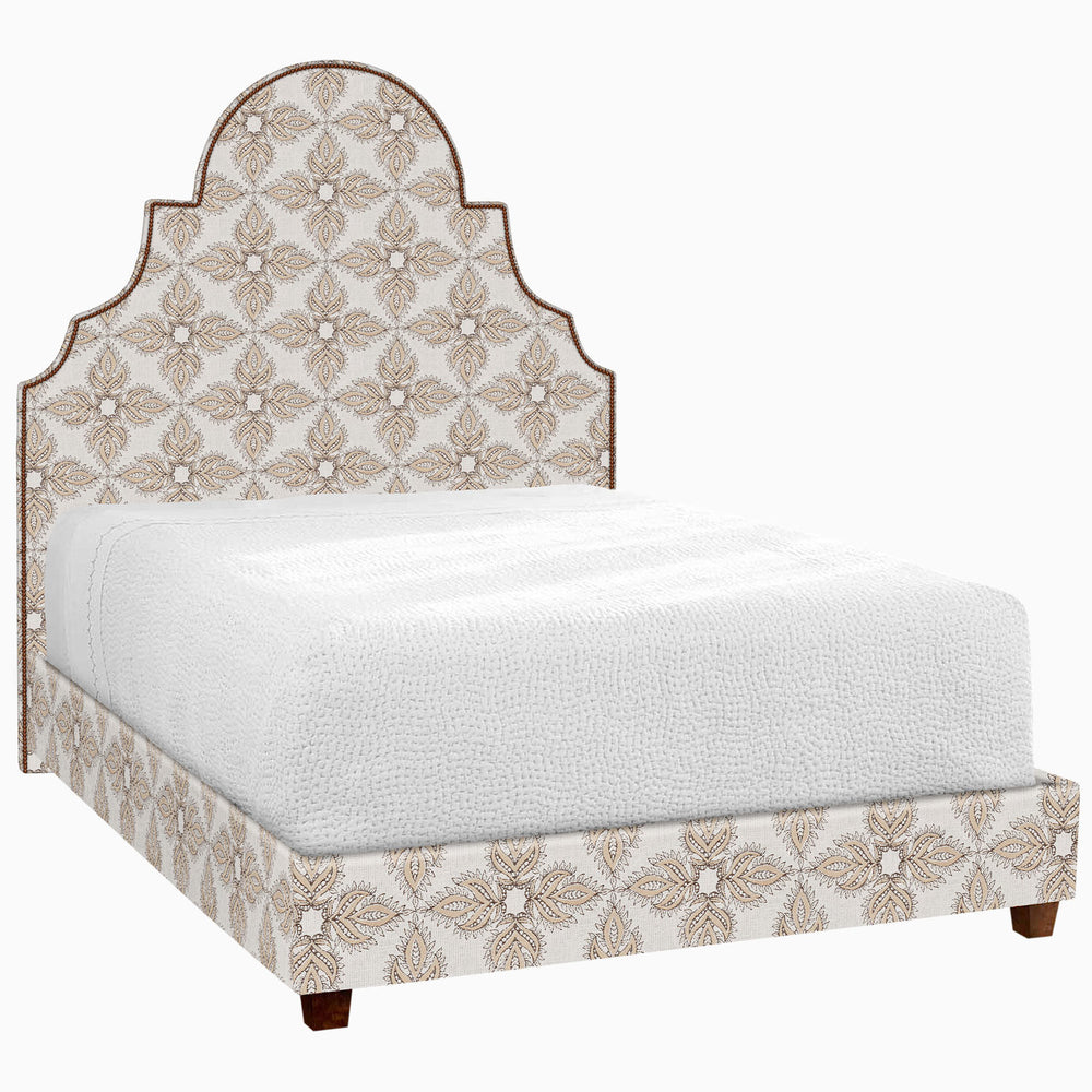 A Custom Dara Bed by John Robshaw with an ornate headboard and footboard available for white glove delivery.