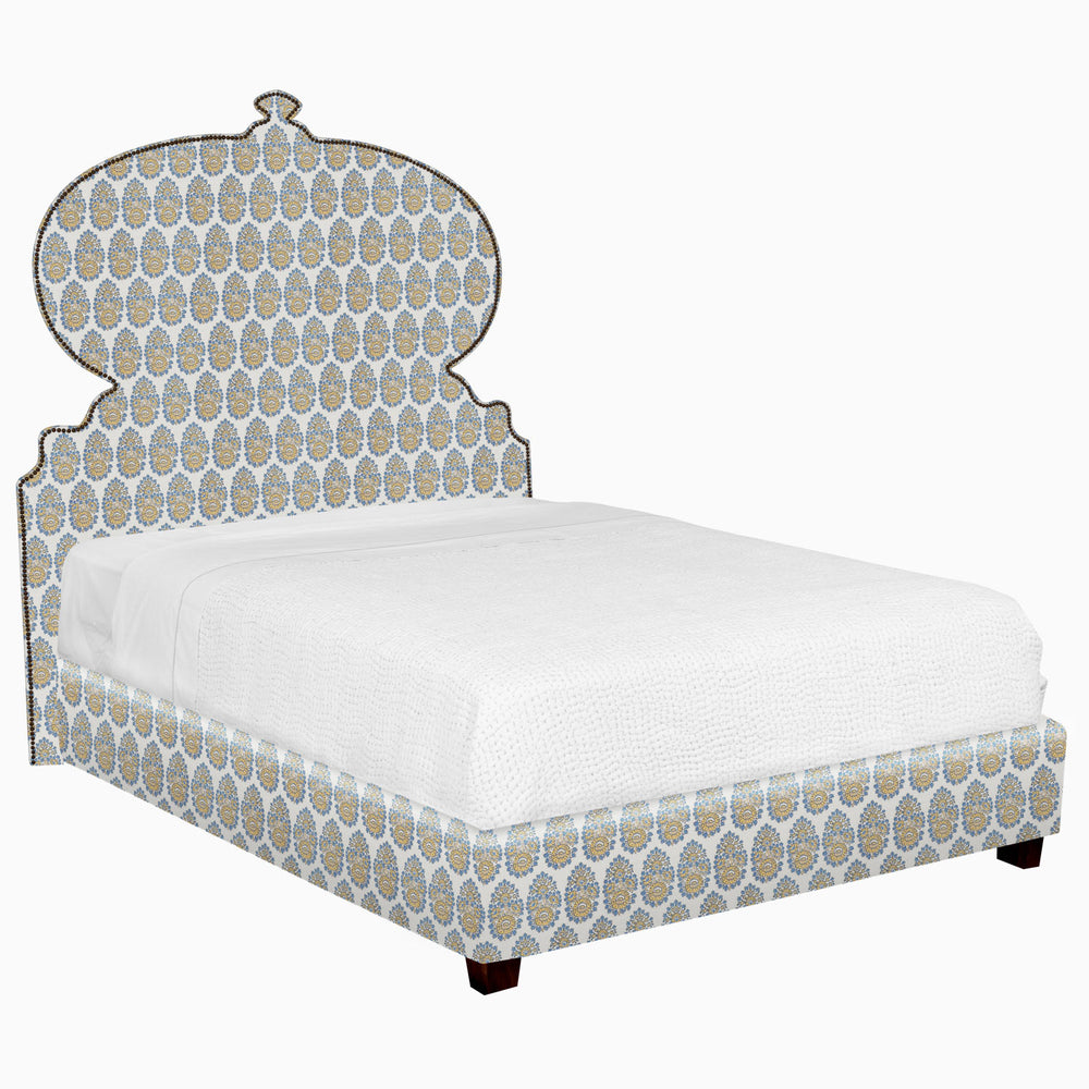 A Custom Orissa Bed with a blue patterned headboard and footboard available for shipping by John Robshaw.