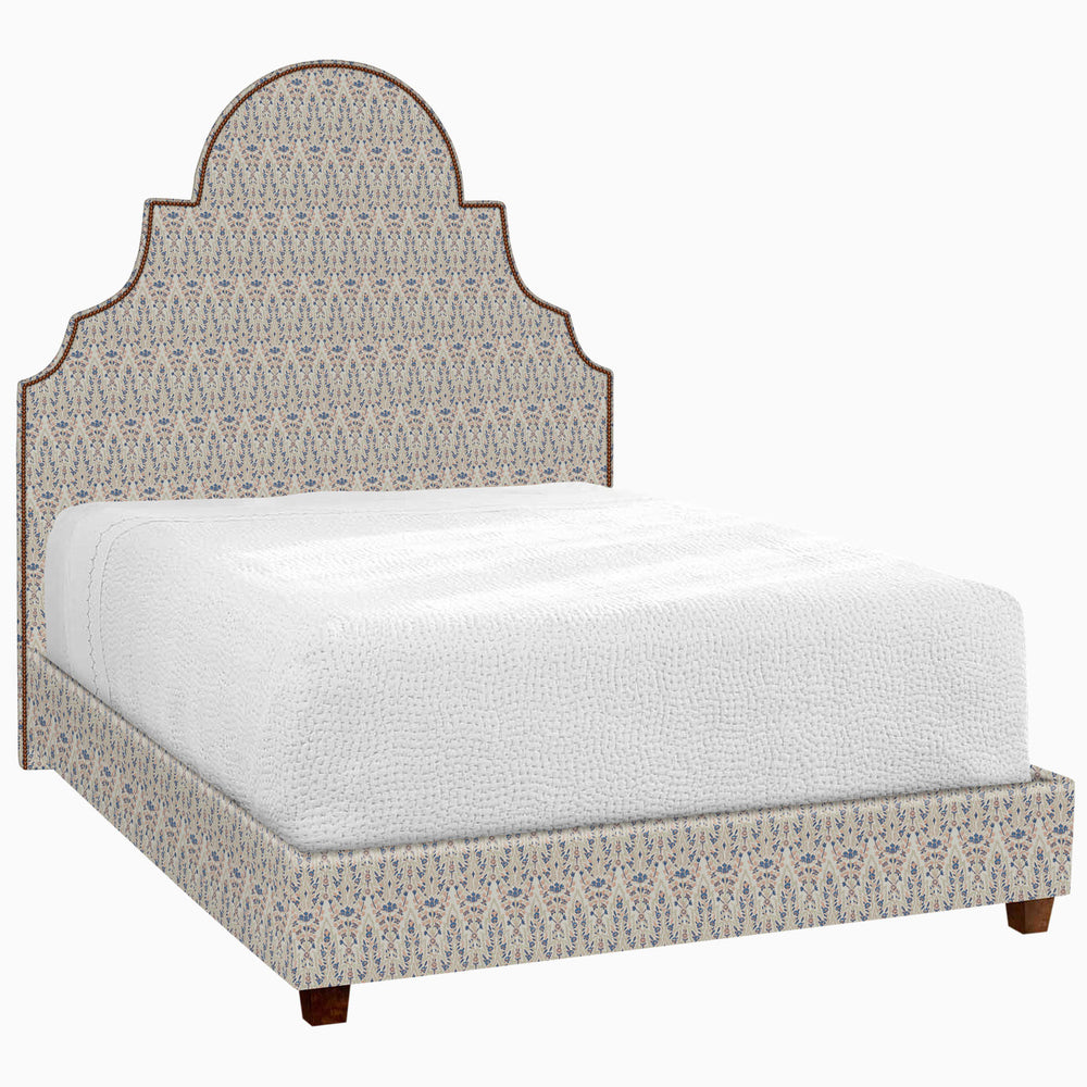A Custom Dara Bed with an ornate headboard and footboard featuring white glove delivery for your convenience, made by John Robshaw.