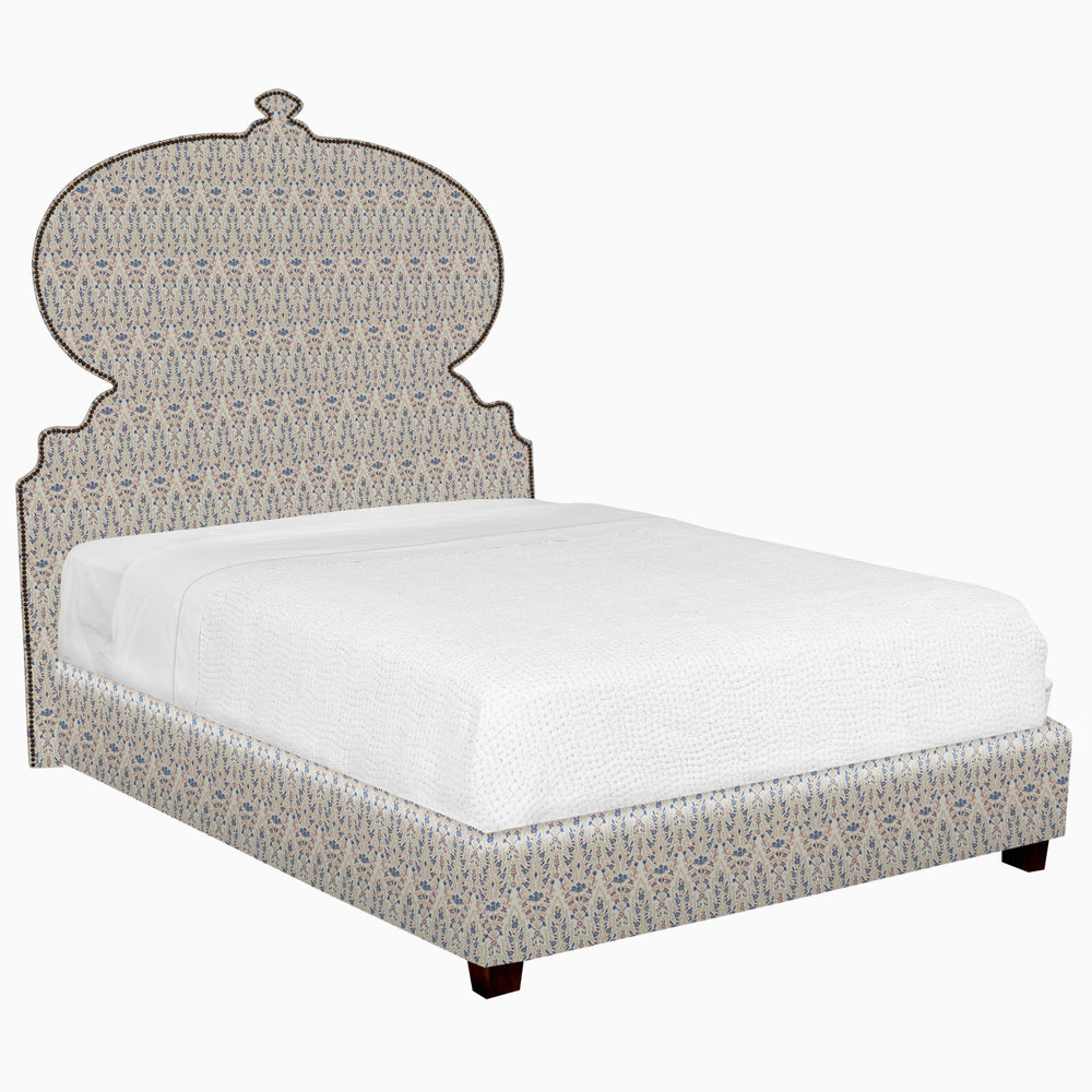 A Custom Orissa Bed with a patterned headboard and footboard available for white glove delivery by John Robshaw.