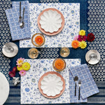 A hand printed John Robshaw blue and white place setting with flowers, Vakula Periwinkle Napkins (Set of 4), and plates. - 30009670008878