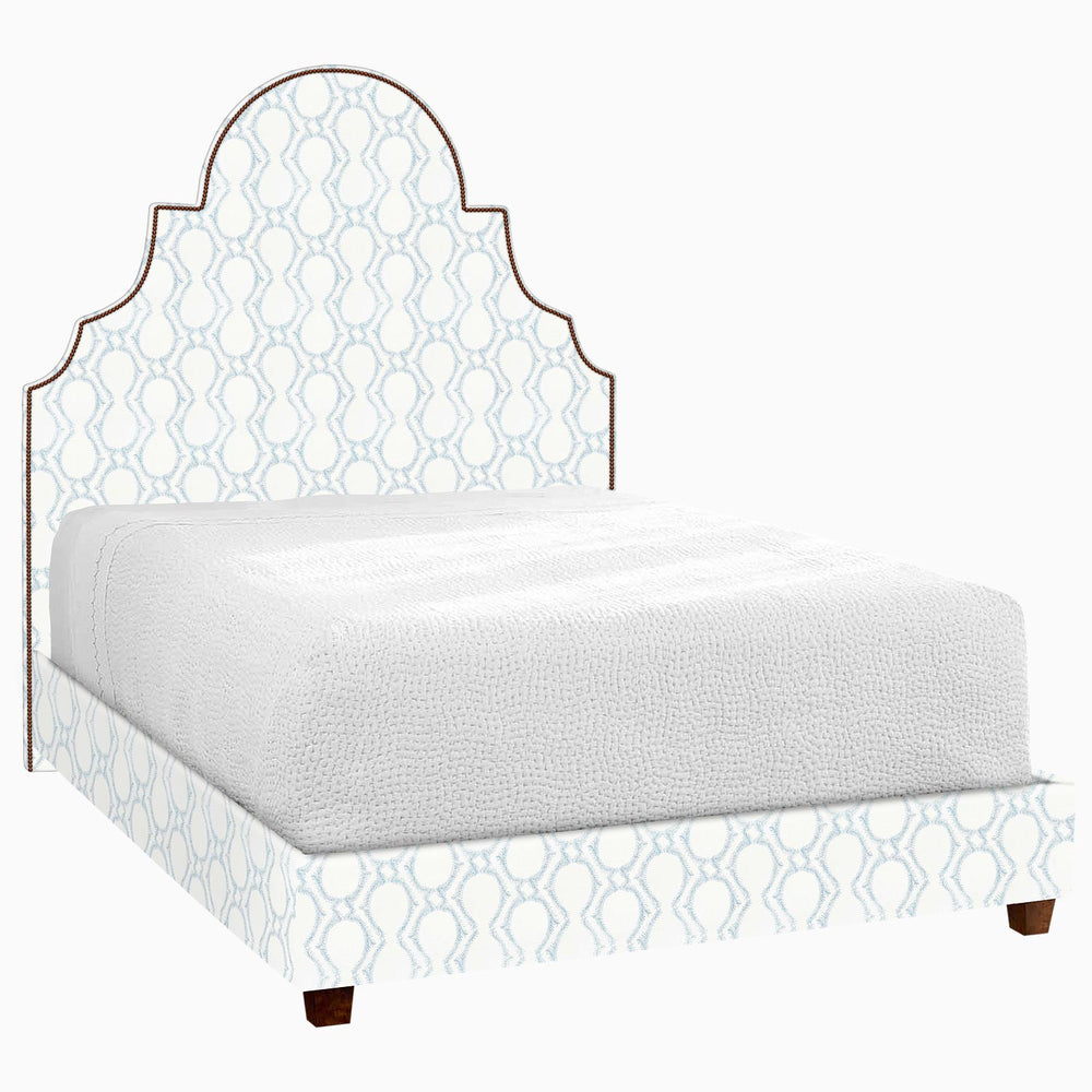 This Custom Dara Bed by John Robshaw features a stunning blue and white pattern.