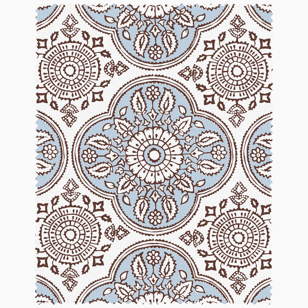 A blue and brown rug with an ornate design, available as a John Robshaw x Cloth & Co. Swatch by John Robshaw.