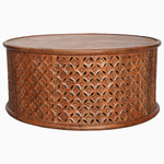 A Round Wooden Jali Table with intricately carved sides by John Robshaw. - 30280699314222