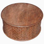 A John Robshaw Round Wooden Jali Table with intricately carved sides featuring a diamond motif. - 30280699019310
