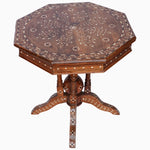 An John Robshaw octagonal wooden table with bone inlay floral designs. - 30296334237742