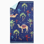 A Dhule Indigo Beach Towel with camels, palm trees on it. Brand: John Robshaw. - 29274368213038