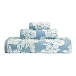 An embroidered Pasak Blue Bath Towel from John Robshaw with a floral pattern. - 28268378095662