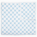 A Layla Azure Quilt by John Robshaw, a cotton voile blue and white blanket with a geometric pattern inspired by Mughal gardens. - 29981019897902