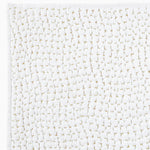 A John Robshaw white rug with gold and hand stitching, named the Organic Hand Stitched Sand Quilt. - 28009904373806