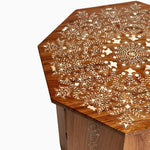 A John Robshaw Natural Bone Inlayed Coffee Table with Wood Skirting, featuring floral designs on it. - 29031157334062