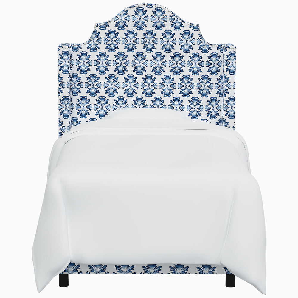 The John Robshaw Samrina bed is adorned with a striking blue and white damask pattern, reminiscent of Mughal arches. This exquisite piece crafted by John Robshaw enhances any bedroom's aesthetic.