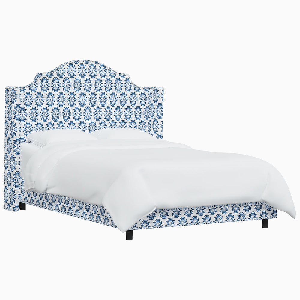 The John Robshaw Samrina bed features a mesmerizing blue and white patterned headboard inspired by Mughal arches.