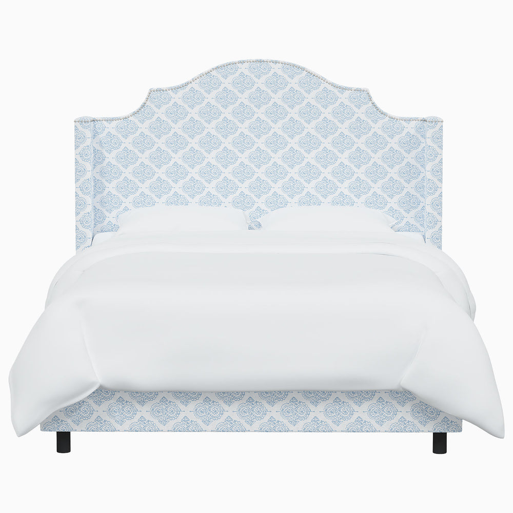 A Samrina Bed by John Robshaw, with a blue damask pattern inspired by Mughal arches.