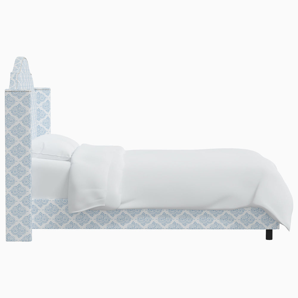 The Samrina bed, curated by renowned designer John Robshaw, features a beautiful blue and white pattern.