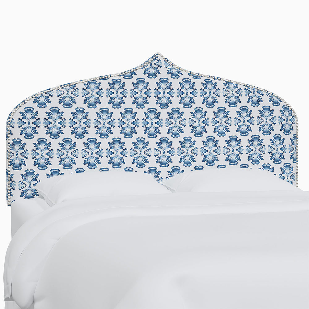 A bed with the Alina Headboard by John Robshaw featuring Mughal arches.