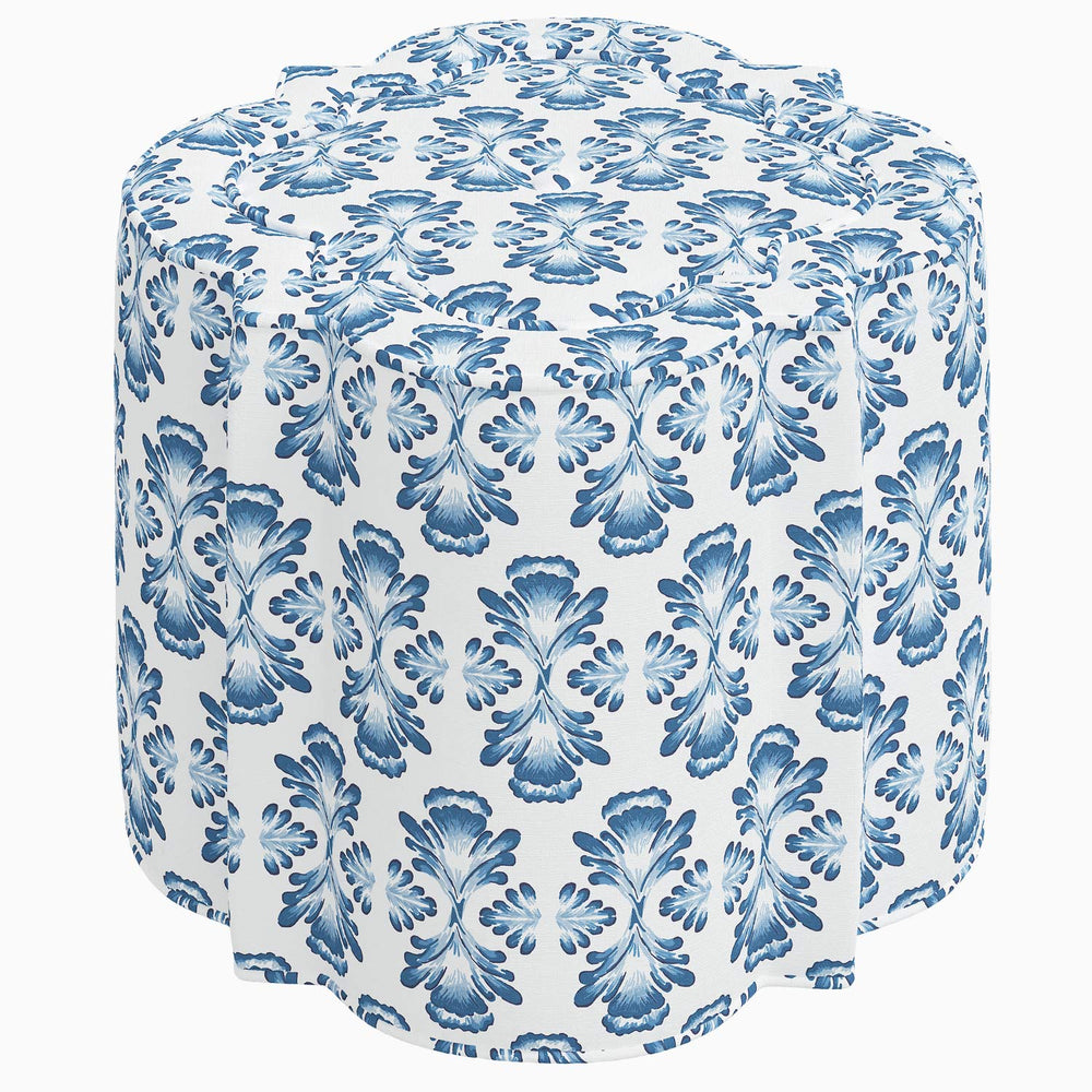 An interior Shiza Ottoman in a blue and white floral swatch pattern by John Robshaw.