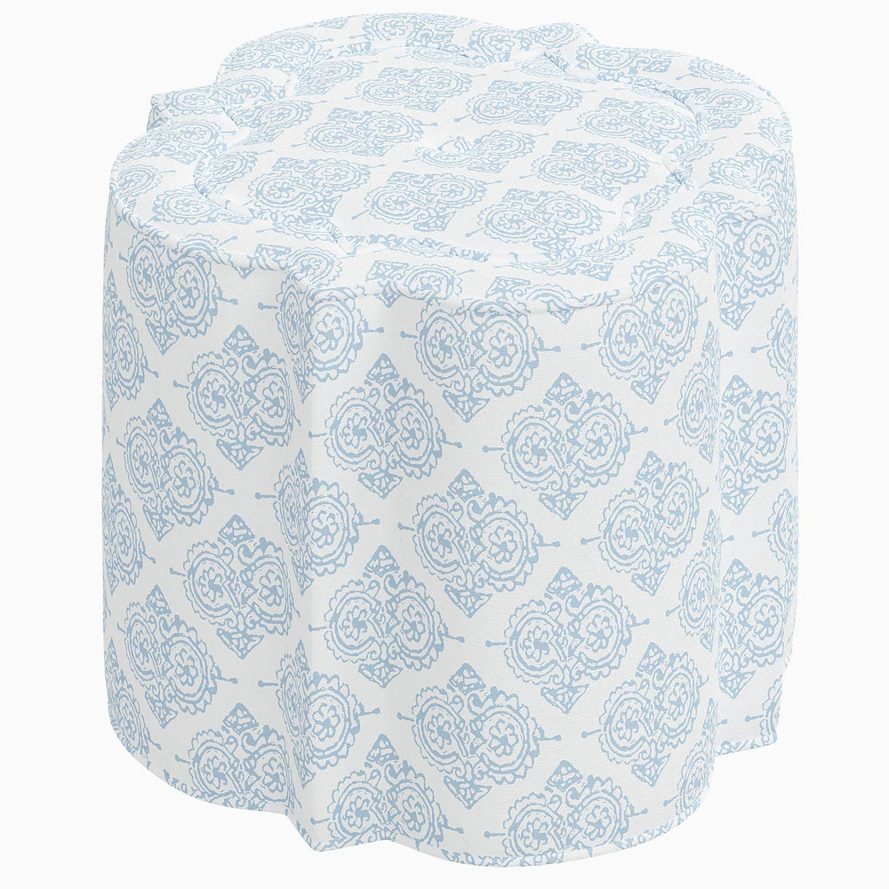 A blue and white Shiza Ottoman from John Robshaw, with a floral pattern, perfect for adding an elegant touch to any interior space.