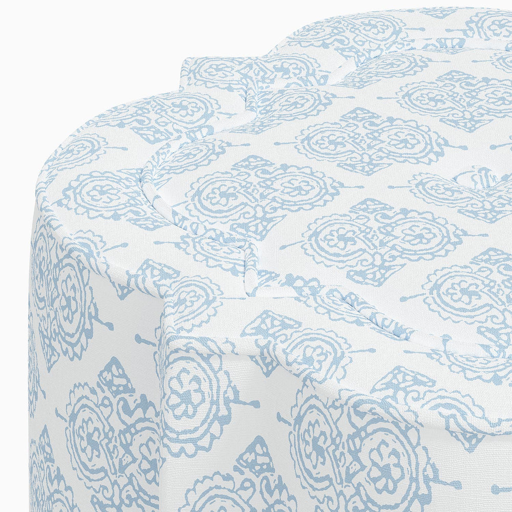 A Shiza Ottoman by John Robshaw, with a blue and white swatch pattern.