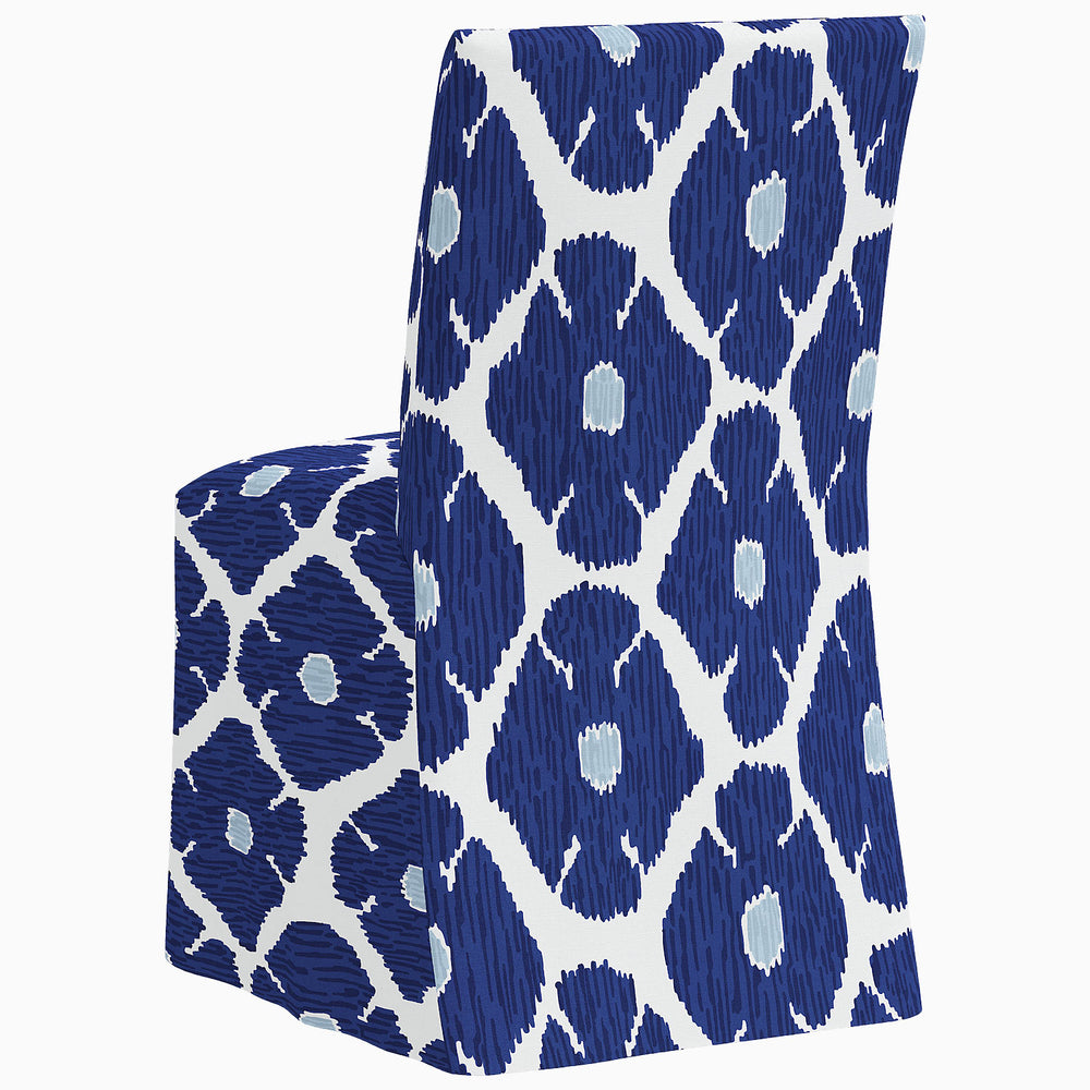 A John Robshaw Sadia Slipcover Chair in a blue and white pattern.