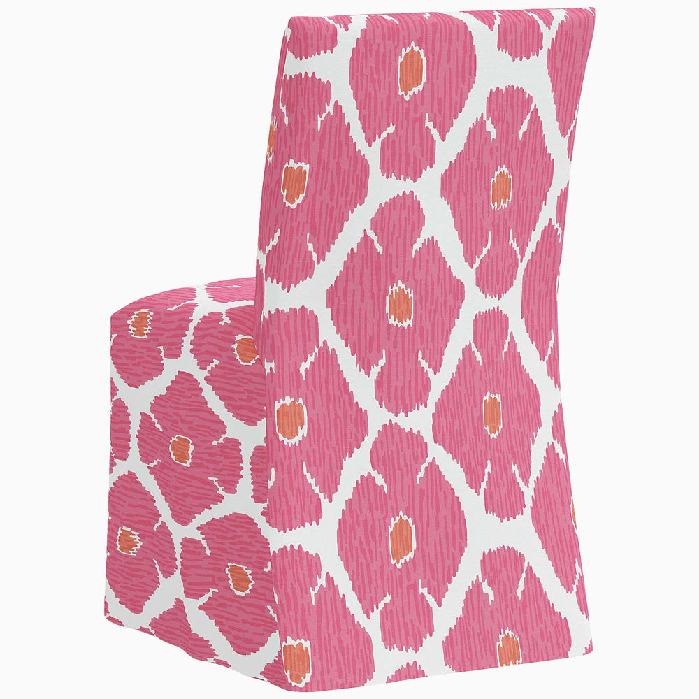 The John Robshaw Sadia Slipcover Chair is a pink and white patterned slipcover designed specifically for dining chairs.