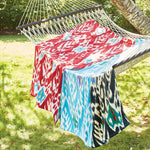 An Umida Ikat Black Beach Towel by John Robshaw-inspired hammock with a soft cotton blanket. - 5797415714862