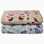 Two Tejal Berry Throw blankets from Throws with diamond pattern stitching on top of each other. - 30497695531054