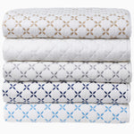 A stack of Layla Gray Quilted Blankets, inspired by Mughal gardens, by John Robshaw. - 30497703559214