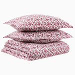 A stack of Taani Berry Organic Duvet pillows made from organic cotton by John Robshaw. - 30395595980846