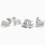 A set of Silver Fern Napkin Rings (Set of 4) by John Robshaw, with raised metal surface. - 30405347541038