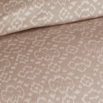 Close-up of the Huma Sand Duvet Set by John Robshaw, showcasing beige fabric with a subtle floral pattern, featuring intricate details that evoke the elegance of a cotton jacquard duvet set. - 31260962357294