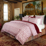 A John Robshaw Taani Berry Organic Duvet with a red and white comforter. - 30395658567726