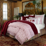 A Velvet Berry Throw handmade by Indian artisans adds a pop of color to the bedroom, with intricate hand quilting details in white. - 30395696185390