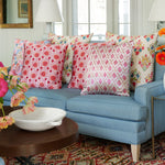 A block printed blue Iyla Berry Decorative Pillow with a floral design in a living room from John Robshaw. - 30403438936110