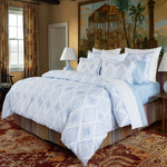 An Eniya Azure Organic Duvet, made of organic cotton and with a high thread count, elegantly adorns a bed. (Brand: John Robshaw) - 30395661385774
