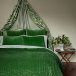 A Quilts & Coverlets hand-quilted green Velvet Moss Quilt bed with a velvet canopy over it. - 30395694940206