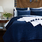 A John Robshaw velvet bed with hand quilted Velvet Indigo Quilt comforter and pillows, made by Indian artisans. - 30395691728942