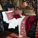 Description: A hand-quilted Velvet Berry Throw bed in a room with a canopy, expertly crafted by Indian artisans, from the John Robshaw brand. - 30395696283694