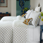 A Layla Sand Quilt by John Robshaw adorns the bed, with a teddy bear nestled among the bedding mix. - 30403072131118